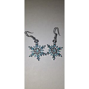 silver-toned snowflake dangle earrings featuring light blue crystals